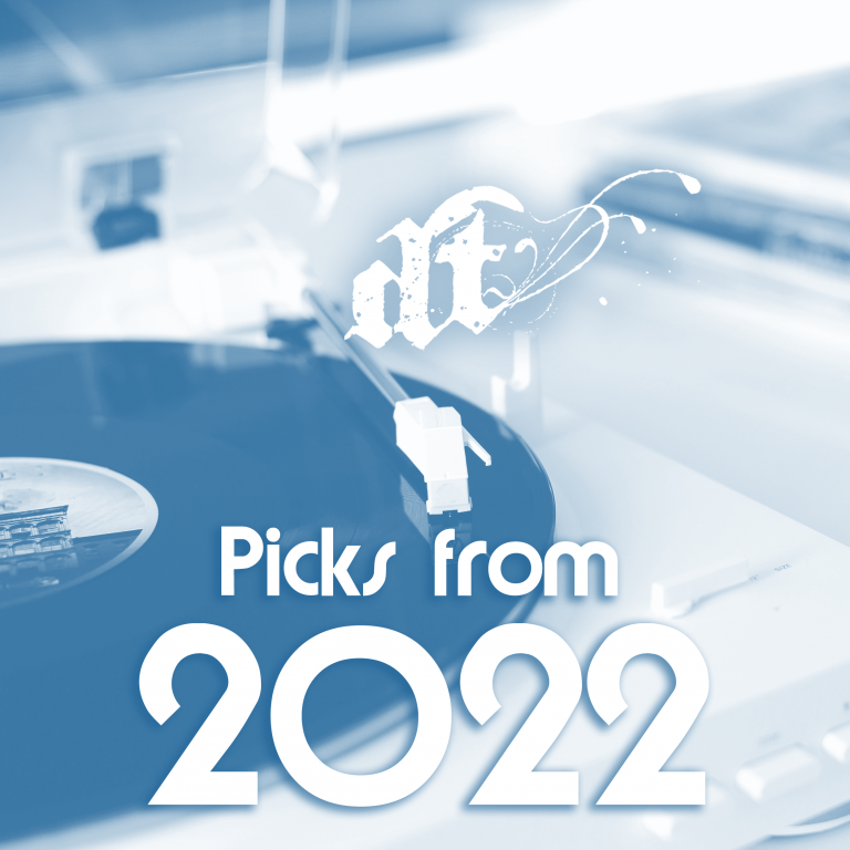 This image shows a blue-tinted photograph of what appears to be a modern, curved white architectural structure or building in the background. In the foreground, there's white text that reads "Picks from 2022" in a clean, modern font. Above this text is a stylized logo that appears to read "dt" with decorative flourishes. The overall aesthetic is minimalist and contemporary, suggesting this might be from a year-end review or compilation piece from 2022.
