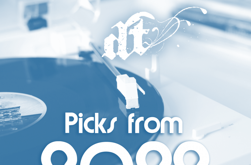 This image shows a blue-tinted photograph of what appears to be a modern, curved white architectural structure or building in the background. In the foreground, there's white text that reads "Picks from 2022" in a clean, modern font. Above this text is a stylized logo that appears to read "dt" with decorative flourishes. The overall aesthetic is minimalist and contemporary, suggesting this might be from a year-end review or compilation piece from 2022.