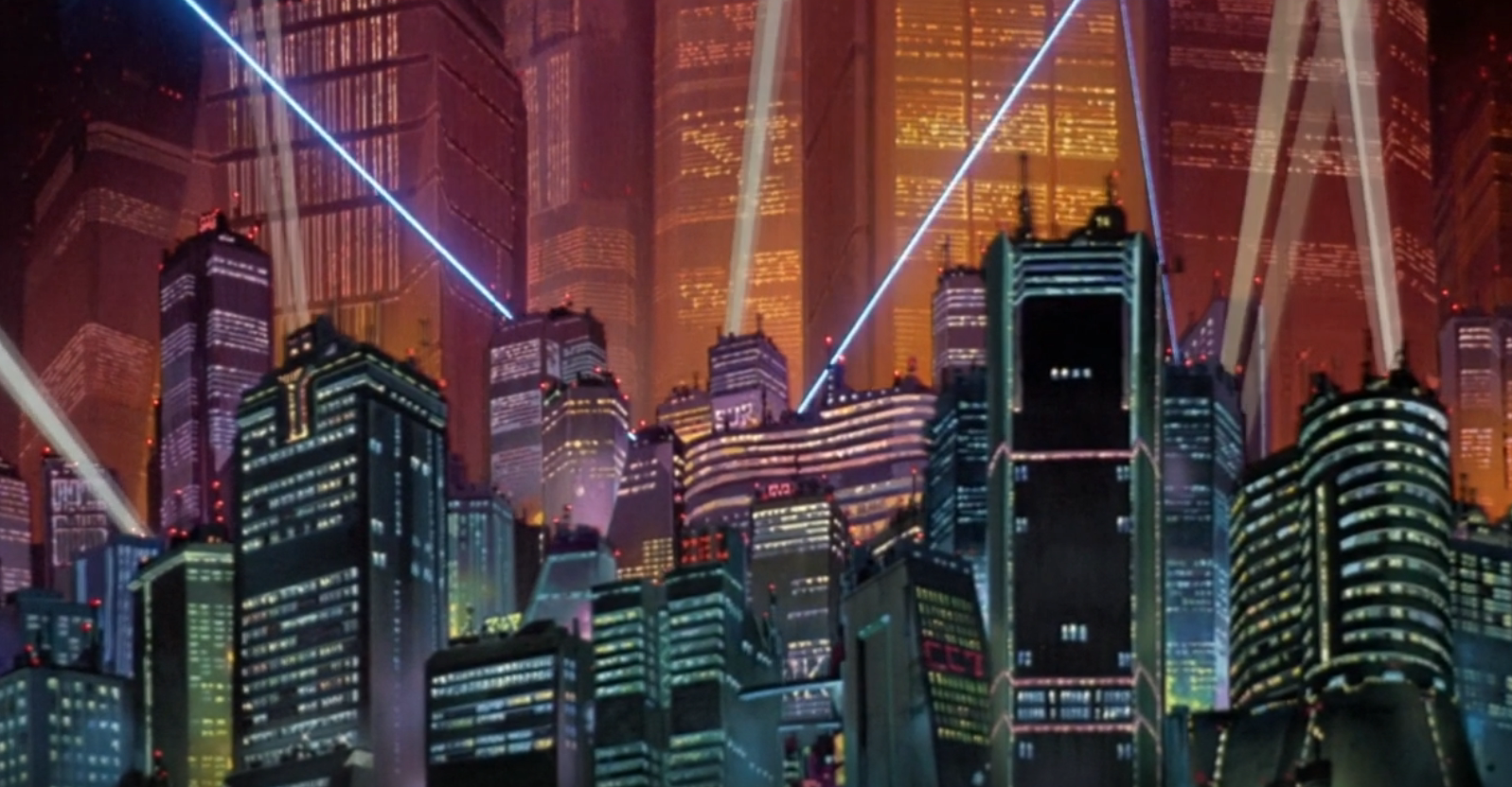 This image depicts a futuristic cityscape with towering skyscrapers illuminated against a dramatic orange and pink sky. The scene features numerous high-rise buildings with lit windows creating a grid-like pattern across their facades. Bright blue laser beams or light rays cut diagonally across the sky, creating a cyberpunk aesthetic. The buildings appear to have a mix of architectural styles, with some featuring curved designs and others more angular structures. The overall atmosphere is reminiscent of a science fiction movie setting, with the warm-toned sky contrasting against the cooler blues and greens of the building lights. The perspective appears to be from ground level looking up at this impressive urban landscape.